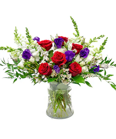 Pink, Purple, Red Roses & Lisianthus is Clear Glass Cylinder
