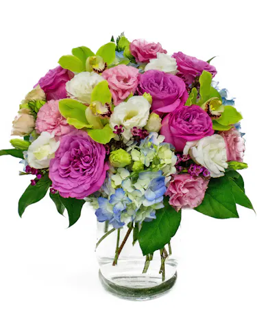 Pink, Purple, Red Roses & Lisianthus is Clear Glass Cylinder