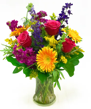 Pink, Orange, & Purple Flowers in a glass vase